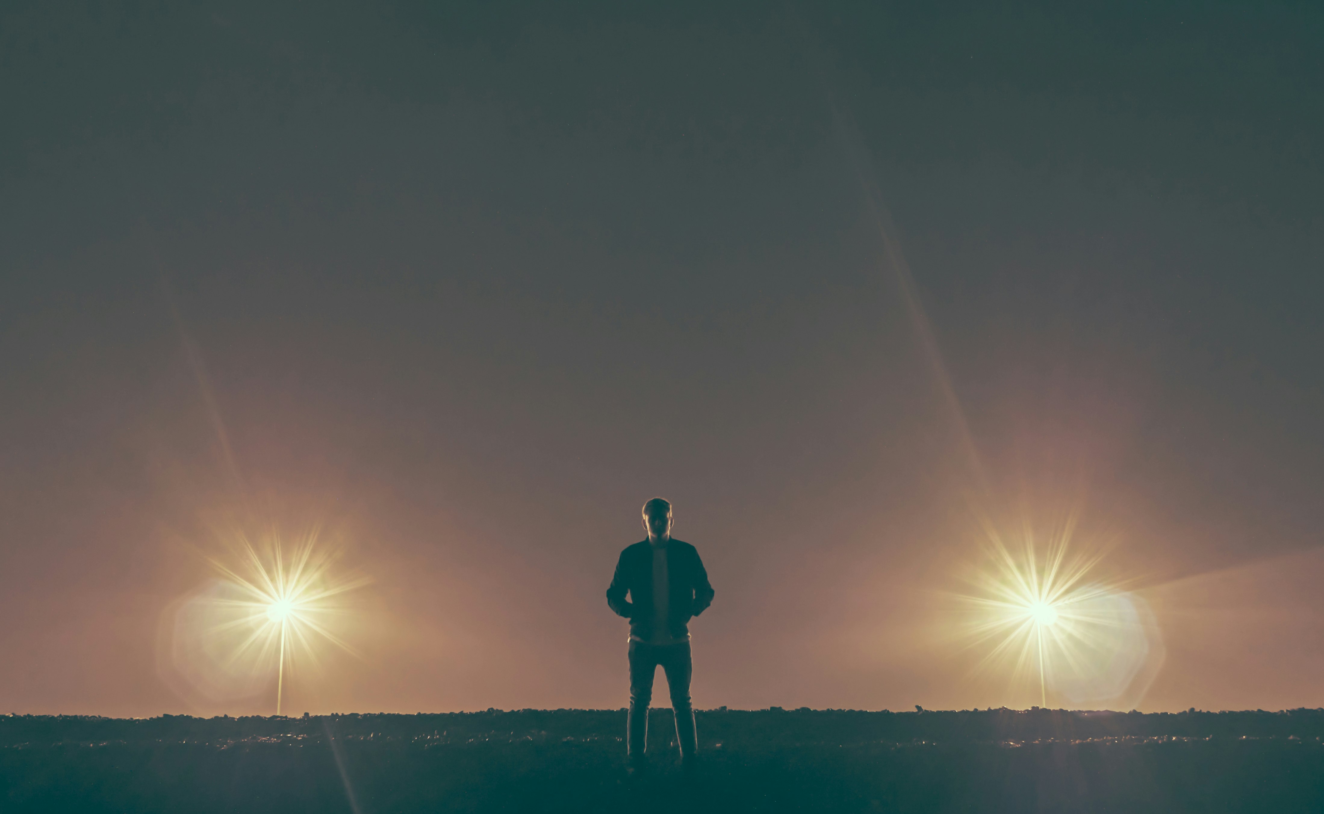 man standing in the middle of nowhere